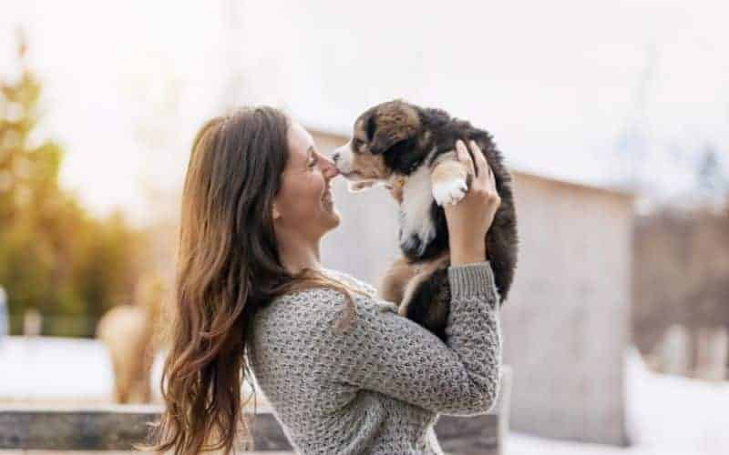 What Is Puppy Yoga? A Detailed Explanation 3 woman with her puppy