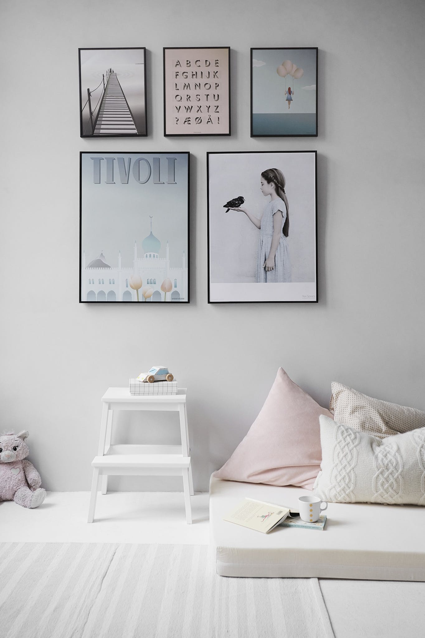 Create a Captivating Gallery Wall That Reflects Your Personality 1 Five Posters Mounted on Wall